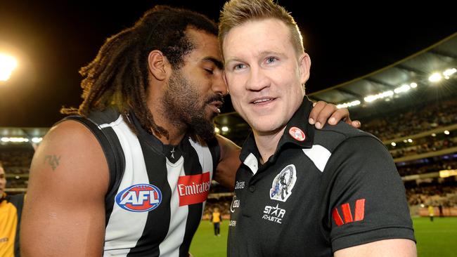 Heritier Lumumba and Nathan Buckley celebrate a Collingwood win in 2013.