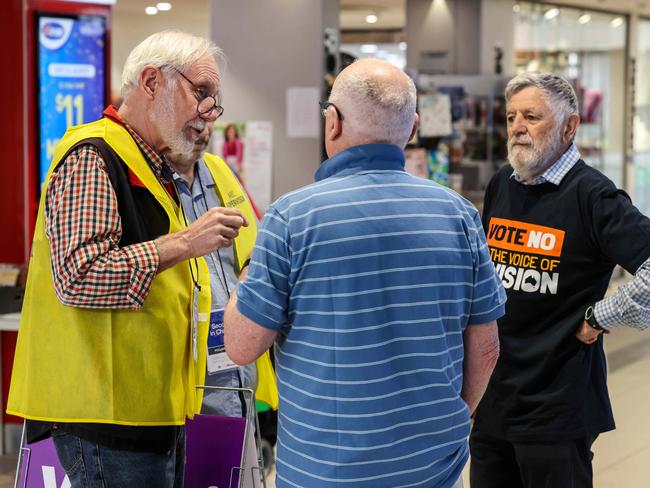 NEWS ADV Early voting booths for the Referendum open today.Yes and No supporters talk with AEC MarshallImage/Russell Millard Photography