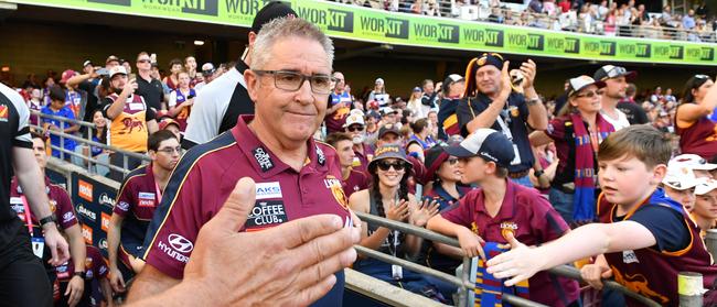 Brisbane fans congratulate coach Chris Fagan after his team beat Geelong at the Gabba in Round 22. Picture: AAP Image/Darren England