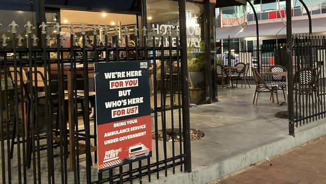 Alice Springs businesses have started putting up union corflutes in support of the paramedics who are advocating for the service to go under government.