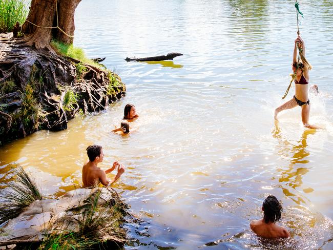 People cooling off in the Nepean River at Jamisontown. Picture: Jonathan Ng