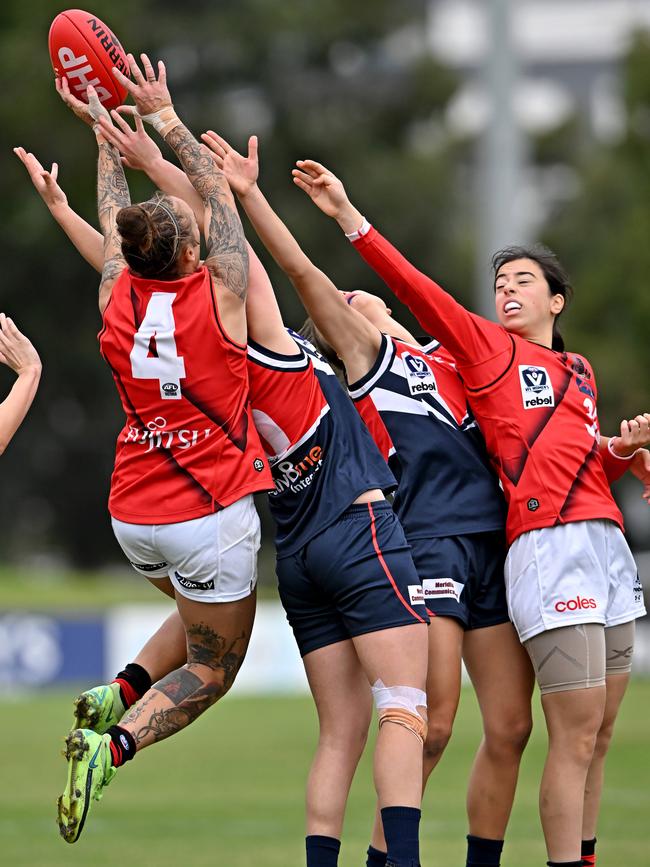 VFLW: Essendon’s Mia Rae Clifford flies for the mark. Picture: Andy Brownbill