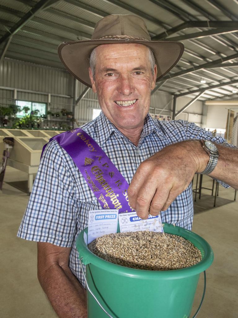 Dallas Zischke with the champion bucket of Barley. Picture: Nev Madsen.