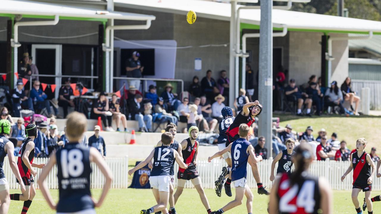 Andre Diem (right) of South Toowoomba Bombers against Coolaroo in U14 AFL Darling Downs grand final at Rockville Park, Saturday, September 2, 2023. Picture: Kevin Farmer