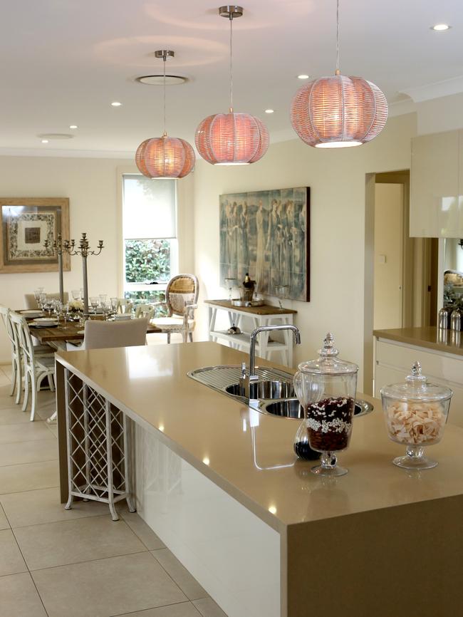 The kitchen features an island bench and walk-in pantry.