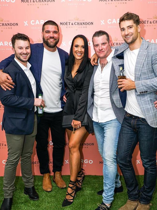 X Cargo bar, Fortitude Valley owners Ayden Sturgess (blue jacket white T-shirt) Angus Cattanach (right of wife, tattoo) and wife Leah Cattanach (middle) Picture Facebook