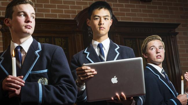 ANZAC Live Promo Photo. Year 11 Camberwell Grammar students (l to r) Hugh Emmett, Michael Liu and Josh Holding using AnzacLIVE, a digital history initiative by NewsCorp to commemorate the Anzac centenary. Picture: Eugene Hyland