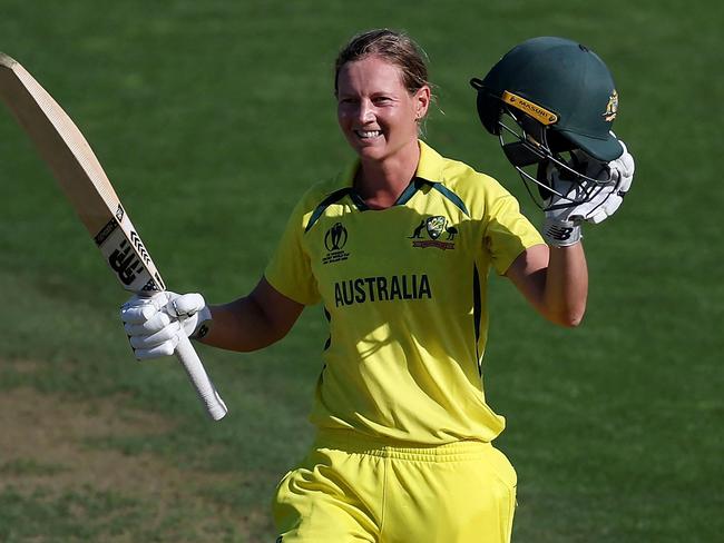 Australia's captain Meg Lanning celebrates after reaching her century (100 runs) during the Women's Cricket World Cup match between Australia and South Africa at the Basin Reserve in Wellington on March 22, 2022. (Photo by Marty MELVILLE / AFP)