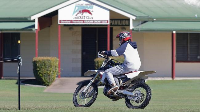 A trail bike rider takes a joy ride across sports fields at Henry Ziegenfusz Park in Cleveland. Picture: Chris Walker.