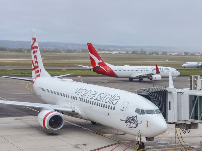 ADELAIDE, AUSTRALIA - NewsWire Photos SEPTEMBER 22, 2021: Virgin, Qantas and Cobham aircraft at Adelaide Airport. Picture: NCA NewsWire /Brenton Edwards