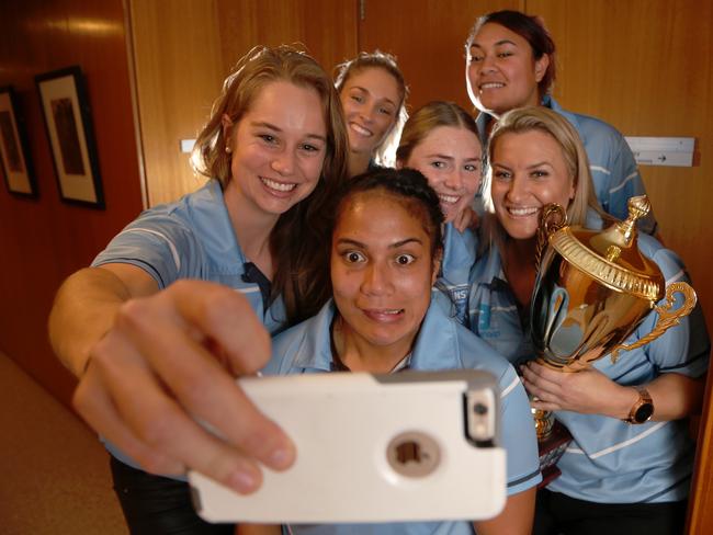 Blues star Kezie Apps takes a selfie with fellow rugby league players.