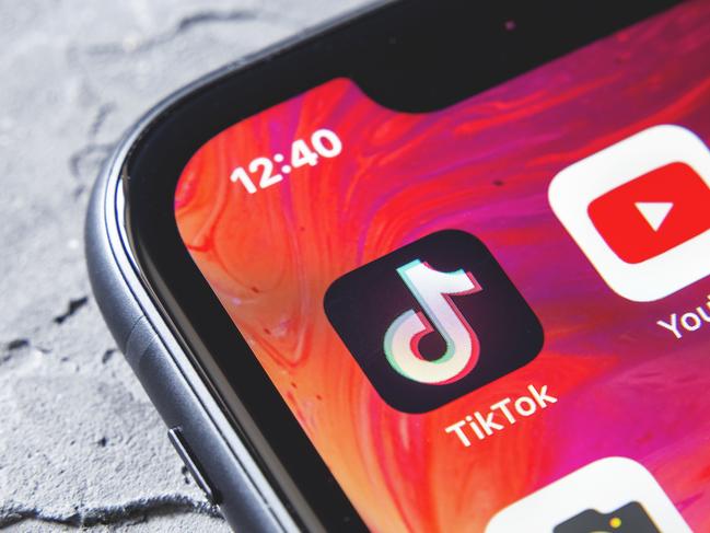 TikTok and YouTube apps on screen iphone xr, close up