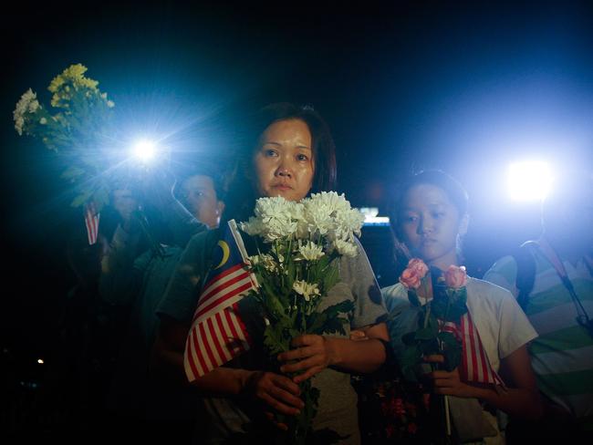 Family of the crew members of MH17 pay their respect during a vigil on July 22, 2014 in Kuala Lumpur, Malaysia. Picture: Getty