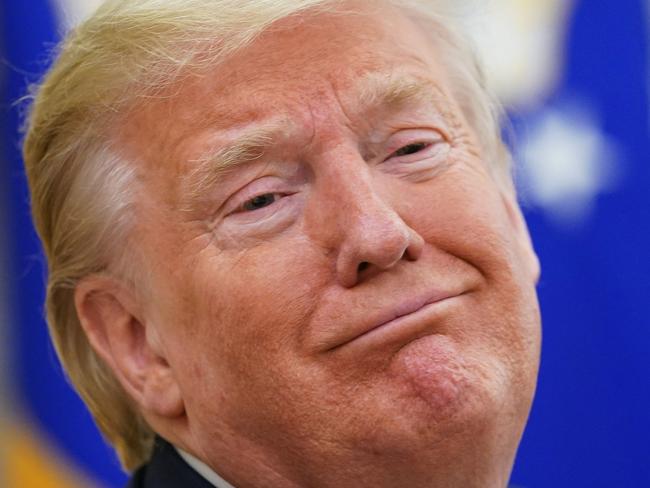 (FILES) In this file photo US President Donald Trump smiles as he meets with Florida Governor Ron DeSantis in the Oval Office of the White House in Washington, DC on April 28, 2020. - As battle lines are drawn ahead of Donald Trump's bid for re-election, a new documentary based on the testimony of mental health professionals has labeled the US president a "malignant narcissist." "Unfit: The Psychology of Donald Trump" -- released on streaming platforms on September 1, 2020 -- claims not to be politically motivated.The film interviews several psychologists who argue they have a medical duty to warn the US public about Trump's alleged mental state. (Photo by MANDEL NGAN / AFP)