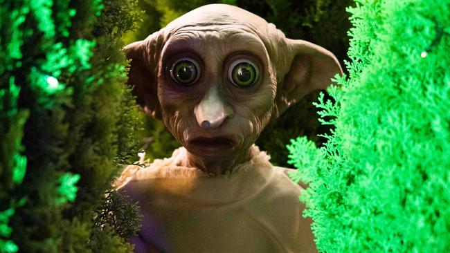 The display features five Dobby statues.