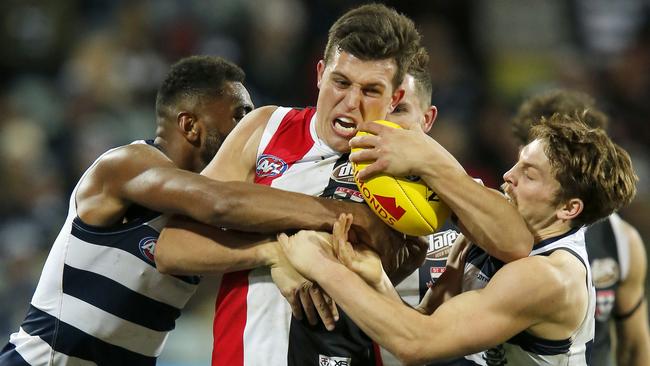 St Kilda’s Rowan Marshall is tackled by Geelong opponent Esava Ratugolea, one of 161 from last Saturday night’s match. Picture: Getty Images