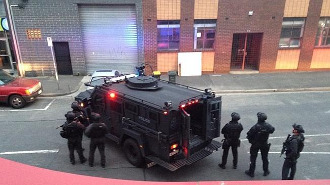 Police swoop on a property in Port Melbourne.