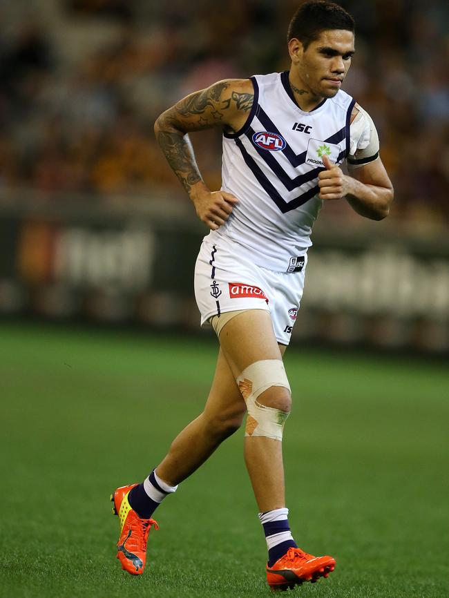 Michael Walters hobbles from the MCG in Round 3. Picture Wayne Ludbey