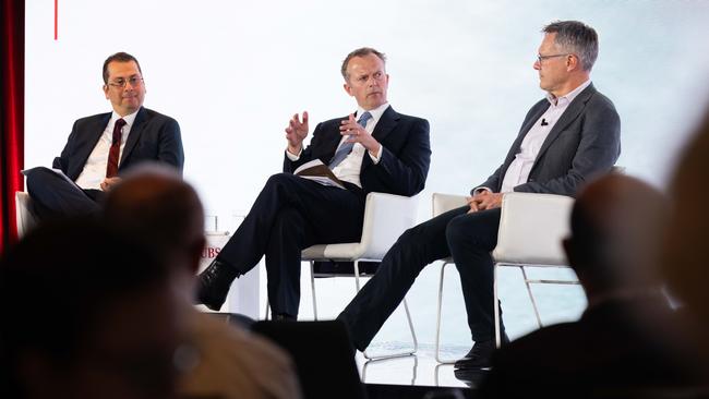 At the UBS Australasia Conference on Monday: from left, George Tharenou, James Aitken and Guy Debelle. Picture: Scott Ehler