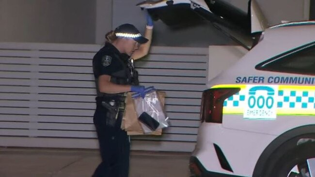 A police officer bags up evidence. Picture: NINE NEWS