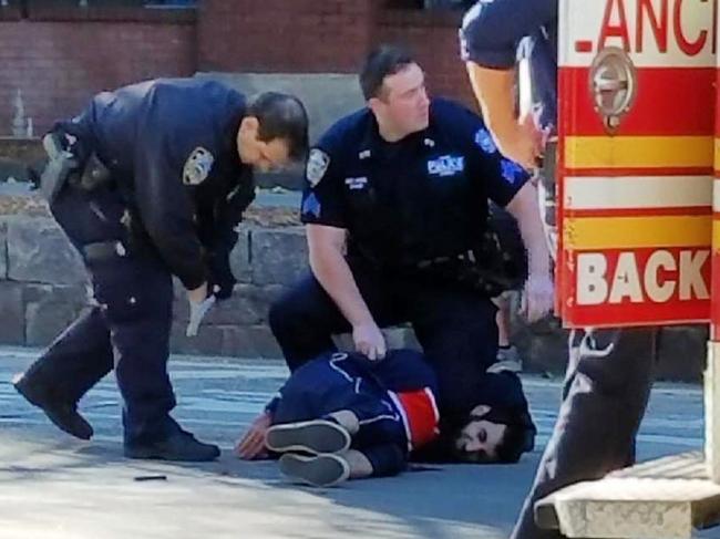 Instagram image of the police detaining a man belived to be the terrorist who drove a truck into people in Downtown New York.@llmaticnycA few people run over by truck on the Westside of New York City lower Manhattan #abc7ny #eyewitnessnews #accident #westside #newyorkcity #chamberstreet #onlyinnewyork #livinginamerica #shotsfired #roadrage #happyhaloween #hallloweentragedy #halloween2017