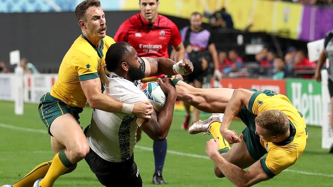 SAPPORO, JAPAN - SEPTEMBER 21: Peceli Yato of Fiji is tackled by Nicholas White of Australia during the Rugby World Cup 2019 Group D game between Australia and Fiji at Sapporo Dome on September 21, 2019 in Sapporo, Hokkaido, Japan. (Photo by Shaun Botterill/Getty Images)