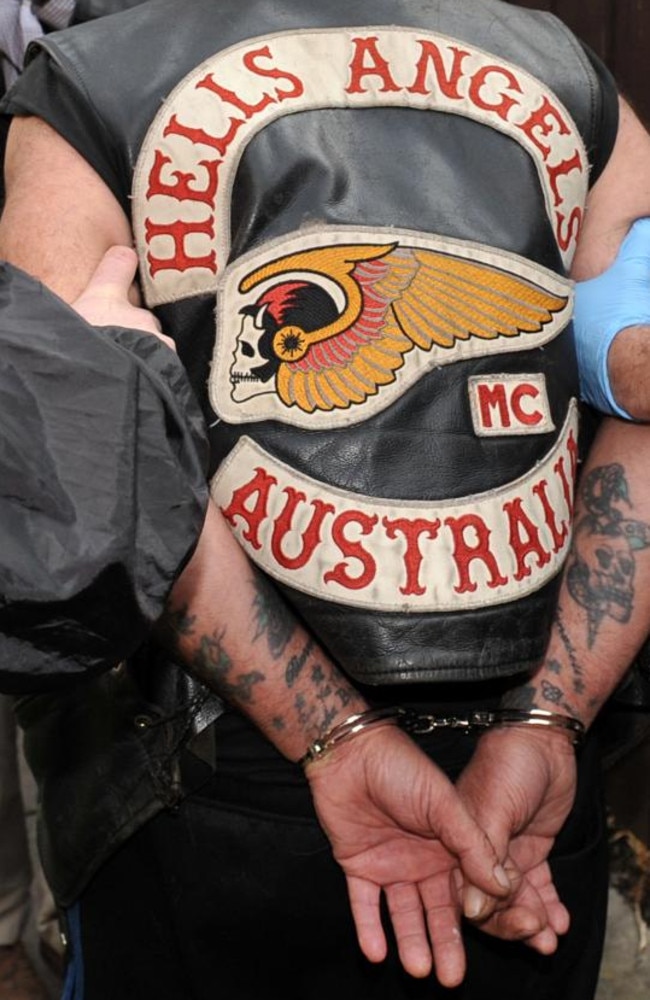 Victoria Police arrest a senior Hells Angels member in 2012, seizing a handgun, cannabis and white powder, were also seized. Picture: Julian Smith.