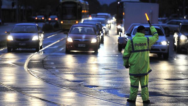 Police direct traffic in Adelaide during the statewide blackout.