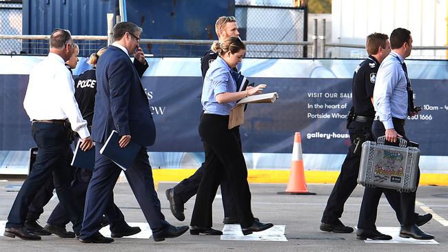 Police arrive at the terminal as P&amp;O Pacific Dawn docks at Portside wharf in Brisbane after a woman fell overboard off the coast of New Caledonia. Picture: AAP/ John Gass.