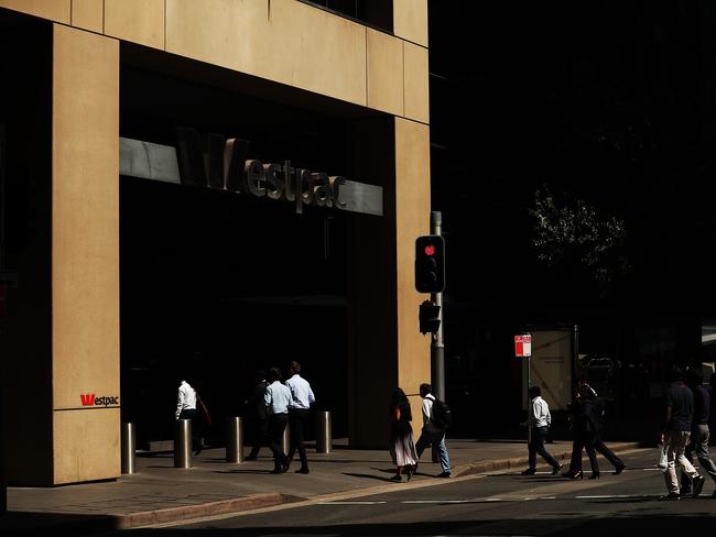 SYDNEY, AUSTRALIA - NOVEMBER 26: Pedestrians walk towards a Westpac bank on November 26, 2019 in Sydney, Australia. Westpac has announced that chief executive Brian Hartzer will step down and chairman Lindsay Maxsted will leave the board early following the launch of an investigation by Australia's financial intelligence agency - AUSTRAC - over a money laundering and child exploitation scandal. AUSTRAC alleges the bank breached anti-money laundering laws 23 million times, including failing to adequately vet thousands of payments potentially linked to child exploitation. (Photo by Mark Metcalfe/Getty Images)