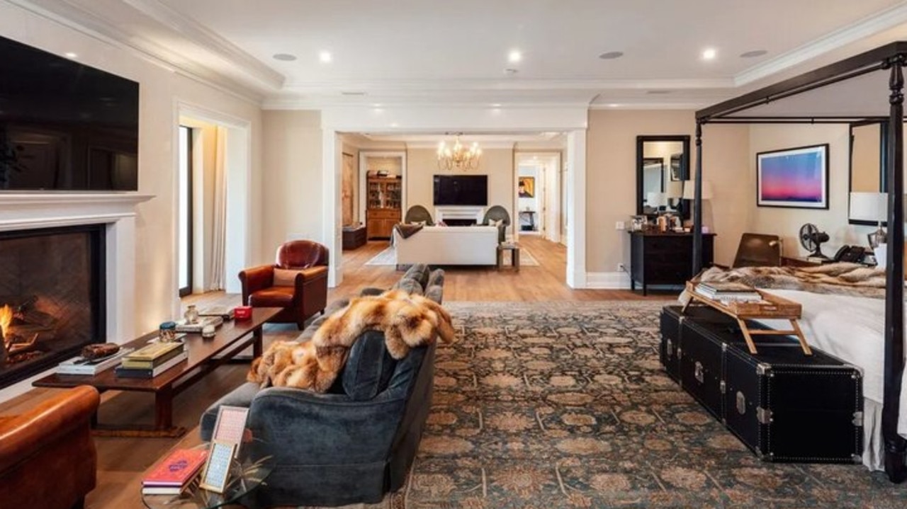 The main bedroom with a fireplace and mounted TV. Picture: Realtor.com