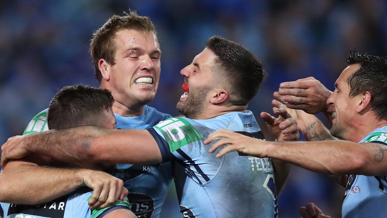 NSW's Jake Trbojevic and James Tedesco celebrate a try.