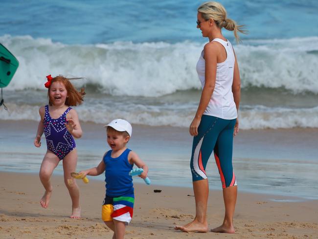 Roxy Jacenko with children Pixie and Hunter at Bondi Beach on Father’s Day while her husband Oliver Curtis is in jail. Picture: Cameron Richardson