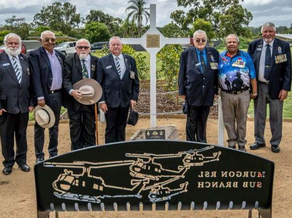 Veterans stand in acknowledgement of those who served and sacrificed for their country at the newly erected Long Tan Cross at the opening of the Veterans’ Memorial Park in Murgon. Photo: Gerkies Photography.