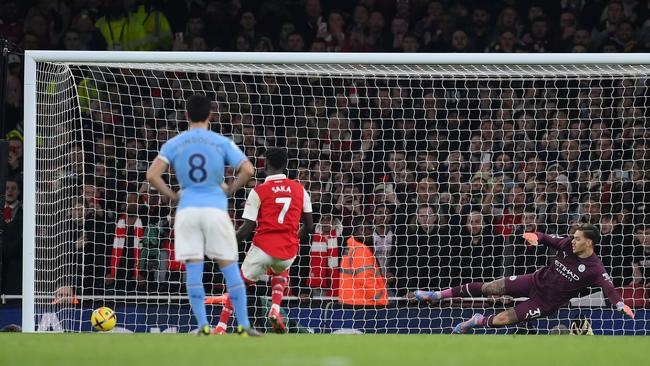 Bukayo Saka coolly put away the controversial penalty. (Photo by Shaun Botterill/Getty Images)