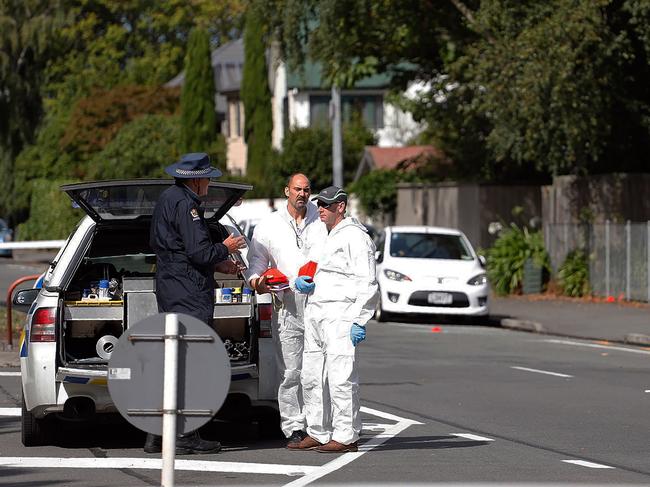 Forensic experts collect evidence near one of the attacked mosques in Christchurch. Picture: AFP