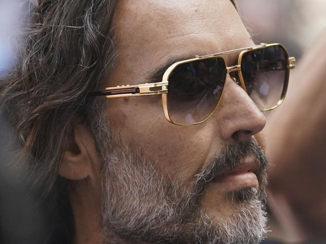 Russell Brand arrives at Westminster Magistrates' court in London, Friday, May 2, 2025, where he faces, rape and sexual assault charges involving four women. (AP Photo/Alberto Pezzali)