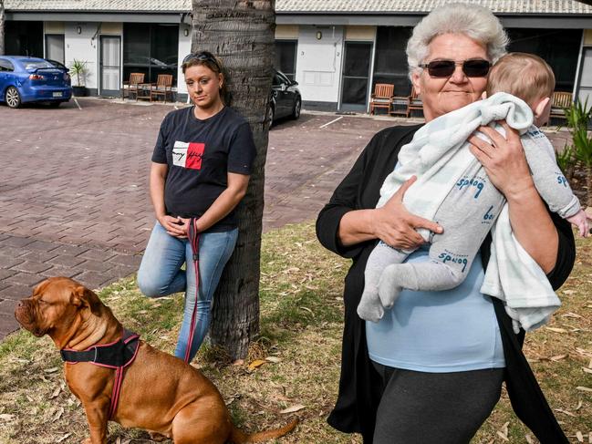 OCTOBER 23, 2024: Angie, Cass Richardson with her dog Armani and Rose Brahimi with her grandson she is raising are staying in the emergency accommodation at Port Noarlunga Motel. Picture: Brenton Edwards