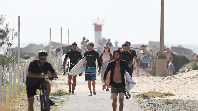 Packs of surfers ignored the warnings. Picture: Adam Head