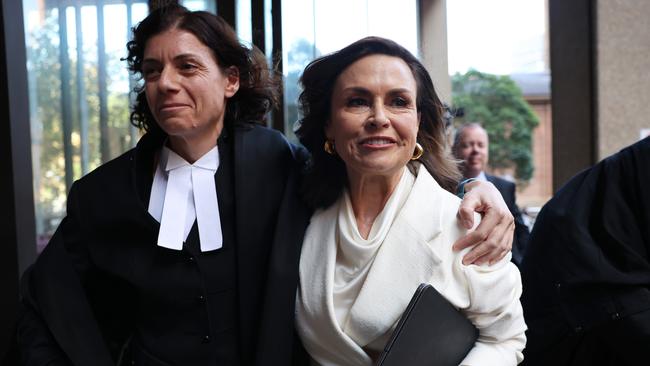 Sue Chrysanthou SC hugs Lisa Wilkinson outside court. Picture: Getty Images