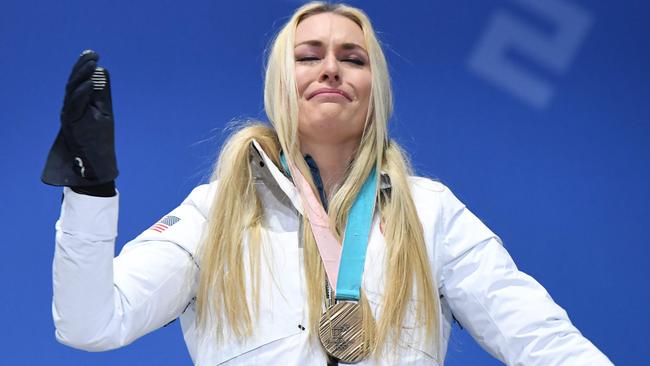 USA's bronze medallist Lindsey Vonn cries on the podium.