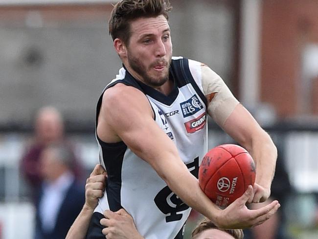 VFL footy: Coburg v Northern Blues.  Coburg 28 Connor Byrne tackles Northern Blues Dale Thomas. Picture: Kylie Else