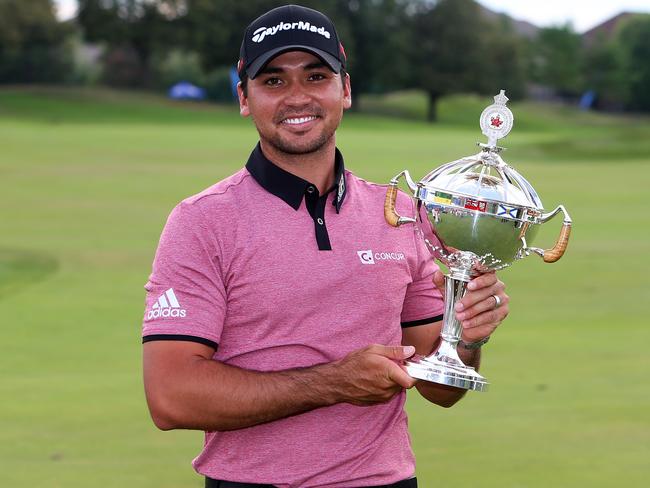 Jason Day celebrates with the winner's trophy after the final round of the RBC Canadian Open at Glen Abbey Golf Club in July. Picture: Getty