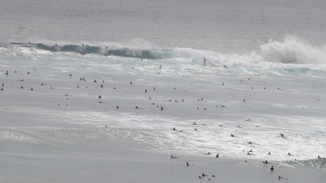 Surfers at Snapper Rocks and Kirra riding the Large swell produced by Cyclone OMA. Photograph : Jason O'Brien