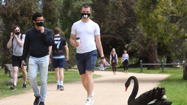 People getting some exercise around Melbourne’s Albert Park Lake. Picture: AFP