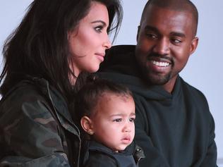 MUST CREDIT GETTY WEB RIGHTS ONLY NEW YORK, NY - FEBRUARY 12: Kim Kardashian, North West and Kanye West attend the adidas show during Mercedes-Benz Fashion Week Fall 2015 at Skylight Clarkson SQ. on February 12, 2015 in New York City. (Photo by Gary Gershoff/WireImage)