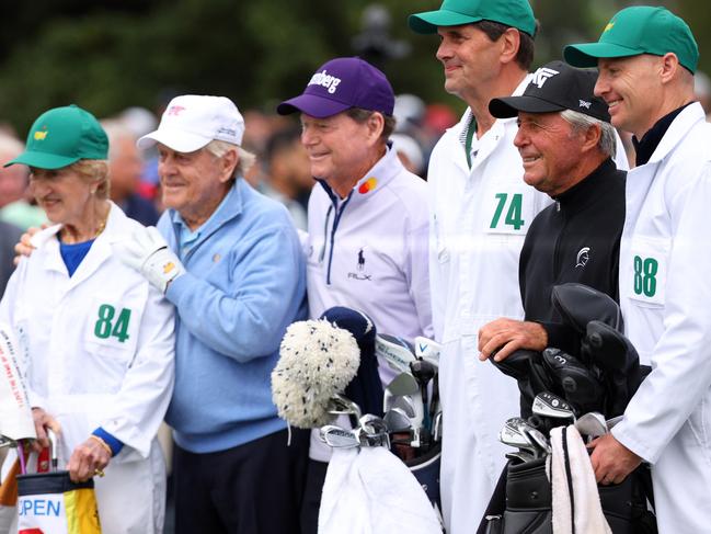 The Honorary Starters Tom Watson, Jack Nicklaus and Gary Player pose with their caddies and Fred Ridley the Chairman of Augusta National Golf Club on the first tee. Picture: Andrew Redington/Getty Images