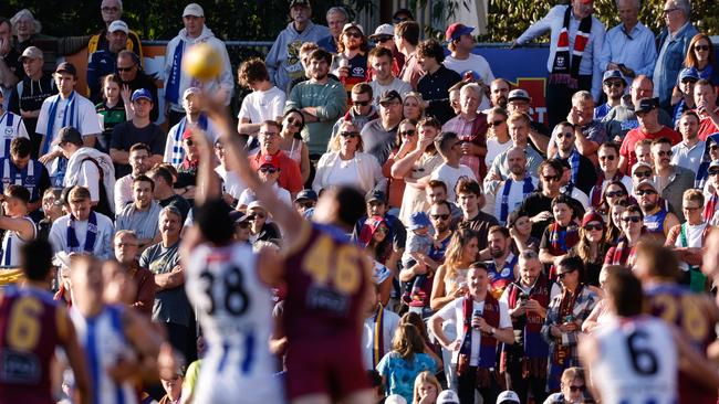 ADELAIDE, AUSTRALIA - APRIL 05: Fans watch on during the 2024 AFL Round 04 match between the Brisbane Lions and the North Melbourne Kangaroos at Norwood Oval on April 05, 2024 in Adelaide, Australia. (Photo by Dylan Burns/AFL Photos via Getty Images)