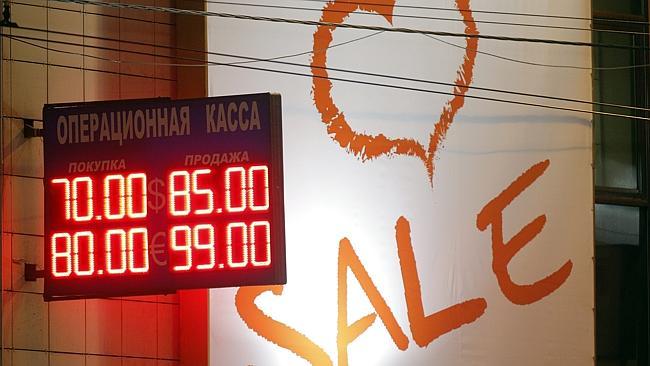 An electronic panel displays exchange rates outside a shopping centre in Moscow.