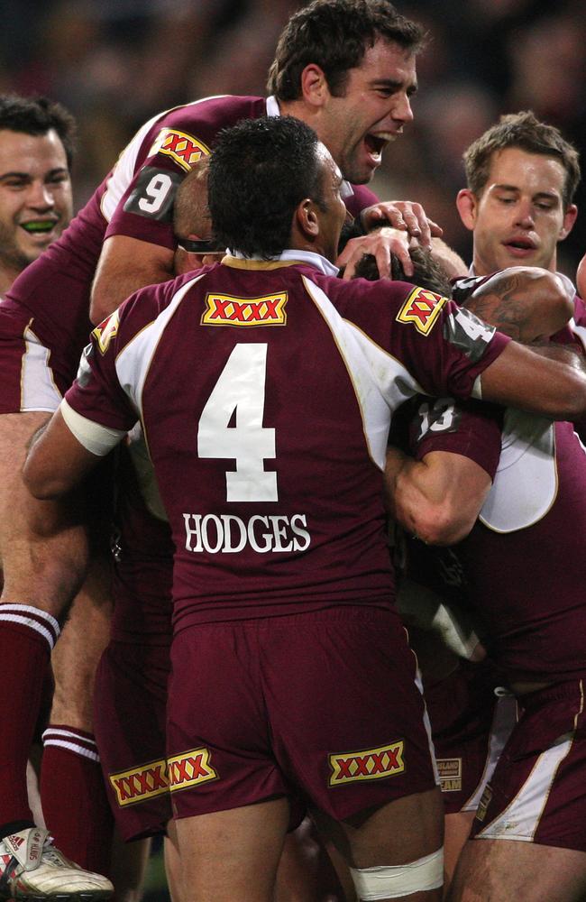 Cameron Smith of the Maroons celebrates a try by Dallas Johnson in 2009.